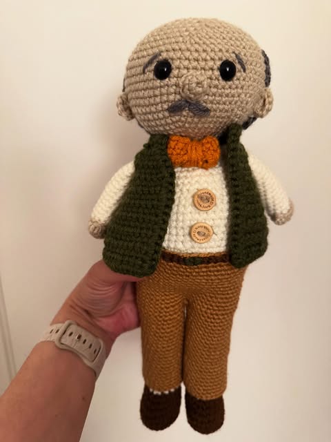 Crochet gentleman doll with a bow tie